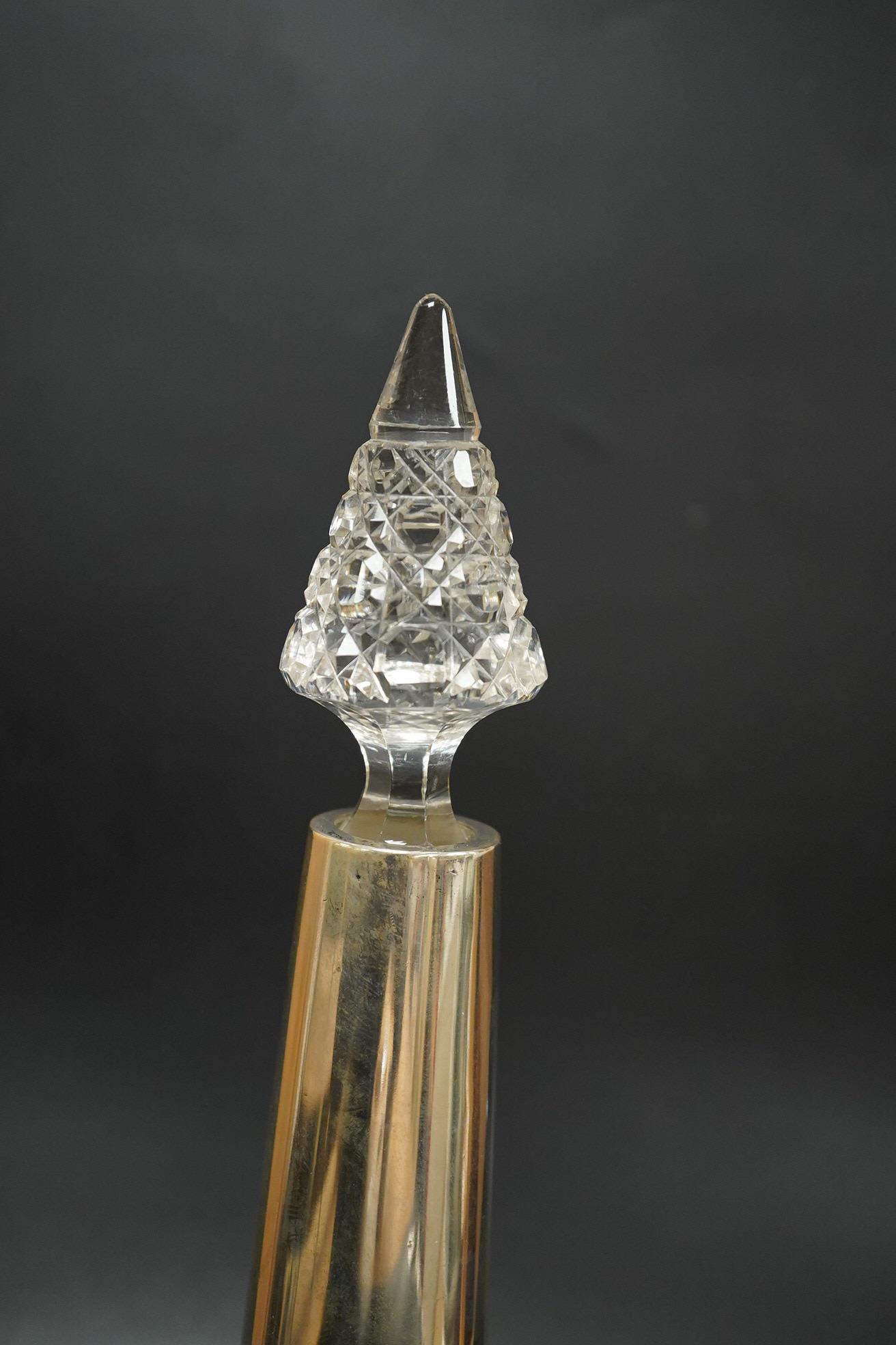 A German 800 standard white metal mounted cut glass decanter and stopper, overall height 36.5cm, together with a George VI silver mounted glass sugar caster.